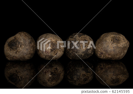 Raw sweet beetroot isolated on black glass Raw sweet beetroot isolated on black glass 62145595