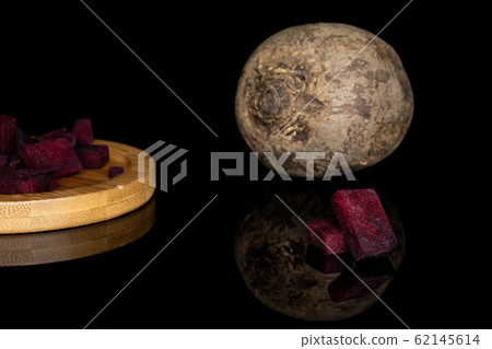 Raw sweet beetroot isolated on black glass Raw sweet beetroot isolated on black glass 62145614