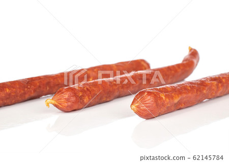 Smoked spicy sausage isolated on white Smoked spicy sausage isolated on white 62145784