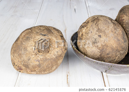 Raw sweet beetroot on grey wood Raw sweet beetroot on grey wood 62145876