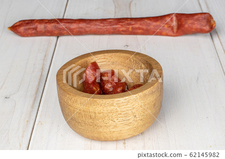 Smoked spicy sausage on grey wood Smoked spicy sausage on grey wood 62145982