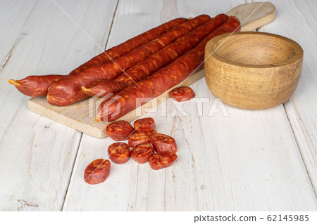 Smoked spicy sausage on grey wood 62145985
