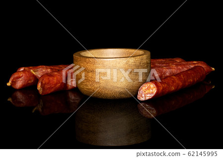 Smoked spicy sausage isolated on black glass Smoked spicy sausage isolated on black glass 62145995