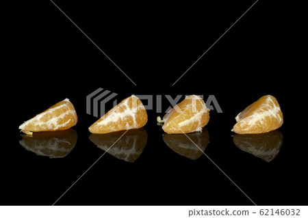 Fresh orange mandarin isolated on black glass 62146032