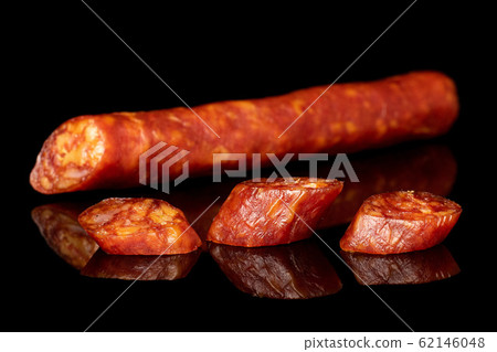 Smoked spicy sausage isolated on black glass 62146048