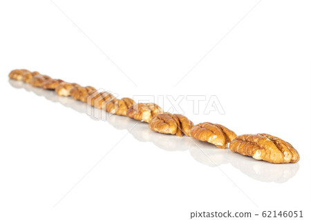 Brown pecan nut isolated on white Brown pecan nut isolated on white 62146051