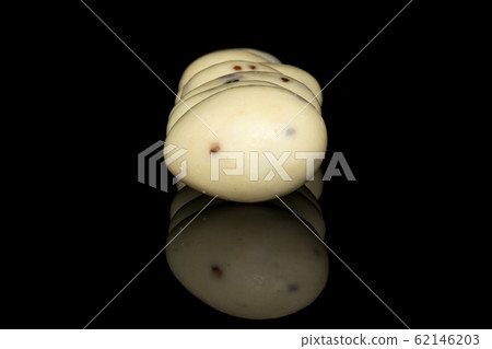 Stracciatella almond nut isolated on black glass 62146203