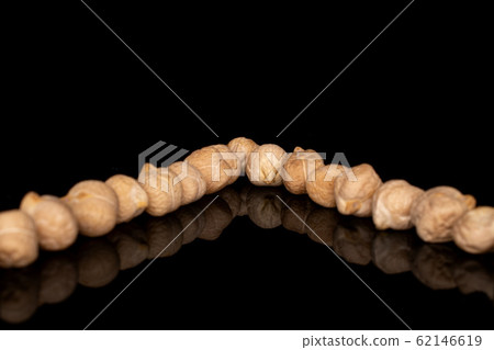 Fresh tan chickpea isolated on black glass Fresh tan chickpea isolated on black glass 62146619