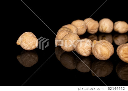 Fresh tan chickpea isolated on black glass Fresh tan chickpea isolated on black glass 62146632