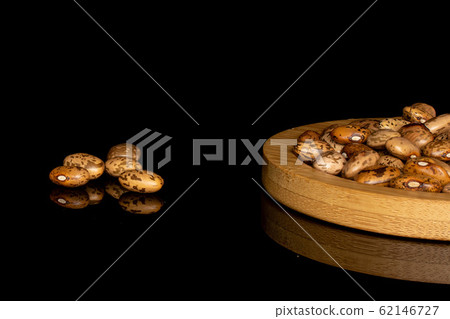 Pinto brown bean isolated on black glass 62146727