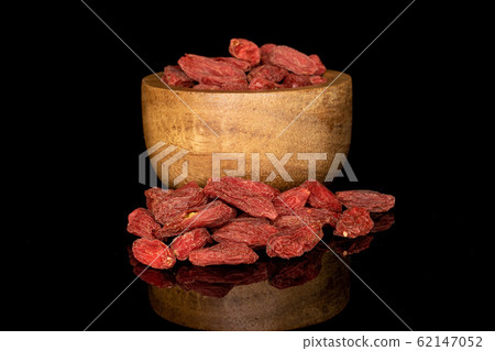 Red dried goji isolated on black glass Red dried goji isolated on black glass 62147052