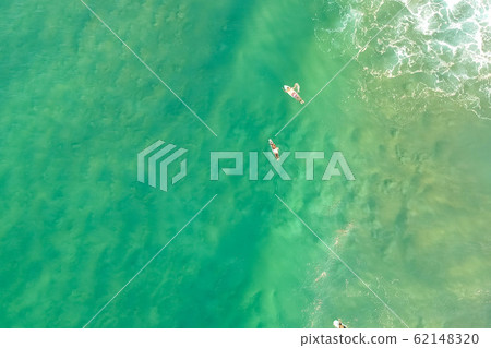 top view drone shot of green water with surfer top view drone shot of green water with surfer 62148320