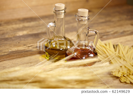 Bundle of uncooked dried Italian spaghetti  on old 62149629