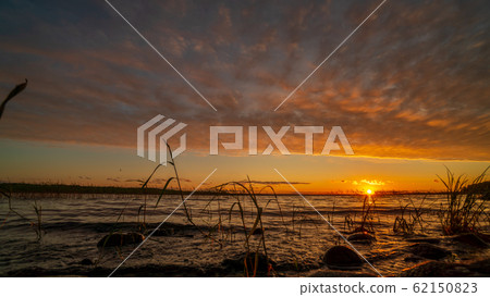 Beautiful lake in Karelia on sunset Beautiful lake in Karelia on sunset 62150823