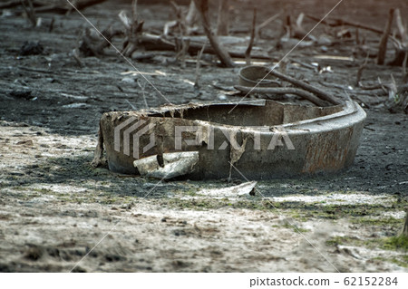 Debris in the water. Holey boat close up. Water 62152284