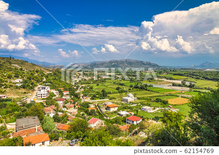 Outskirts of Shkoder town with mountain range. Outskirts of Shkoder town with mountain range. 62154769