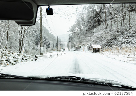 Driving the snow road 62157594