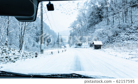 Driving the snow road Driving the snow road 62157595