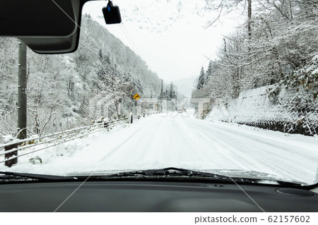 Driving the snow road 62157602