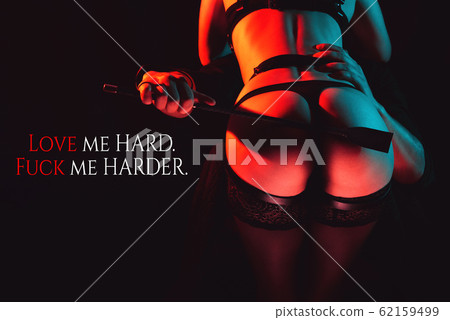 man slaps a leather whip on the ass of a sexy girl 62159499