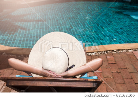 Asian young Women relaxing sleep poolside at Asian young Women relaxing sleep poolside at 62162100