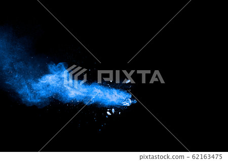 Blue color dust particles explosion cloud on black background.Color powder splash. Blue color dust particles explosion cloud on black background.Color powder splash. 62163475