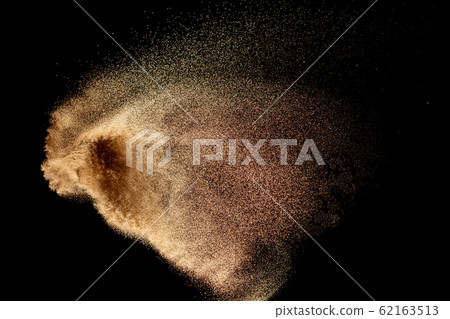 Dry river sand explosion isolated on black background. Abstract sand cloud.Brown colored sand splash. Dry river sand explosion isolated on black background. Abstract sand cloud.Brown colored sand splash. 62163513