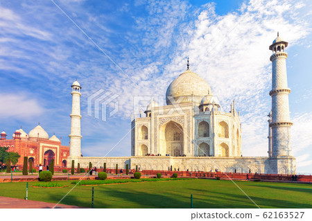 Taj Mahal Tomb and the western mosque, sunny day view, Agra, India Taj Mahal Tomb and the western mosque, sunny day view, Agra, India 62163527