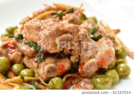 spicy stir fried pork bone with pepper and slice finger root on plate 62167014