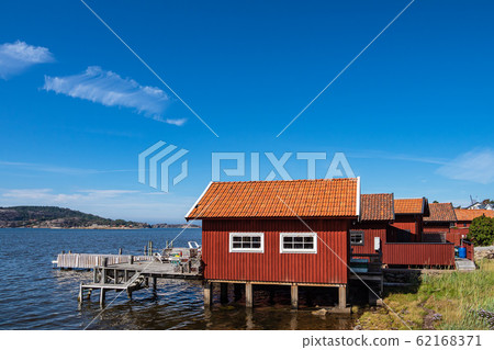 Boathouses near the city Fjaellbacka in Sweden Boathouses near the city Fjaellbacka in Sweden 62168371