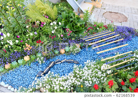 Homemade flowerbed with beautiful cet 62168539