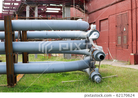 A large iron metal piping trestle with pipes  62170624