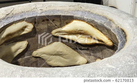 Georgian bread. Shotis Puri with a crispy crust Georgian bread. Shotis Puri with a crispy crust 62170813