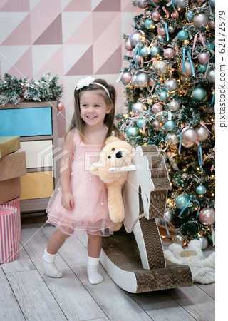 Happy child (a girl of three years old) stands 62172579