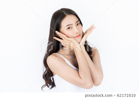 Young asian woman has smiling face and bright skin tone. Asian woman standing with isolated white background. 62172810
