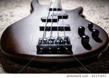 Bass electric guitar with four strings closeup. 62173841