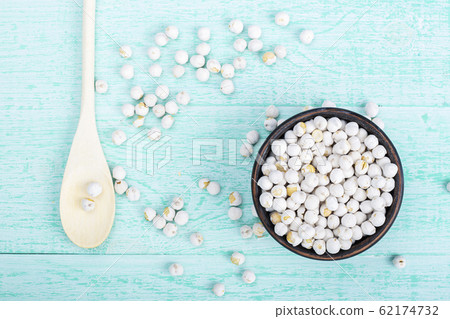 dry chickpeas in a plate on the table dry chickpeas in a plate on the table 62174732