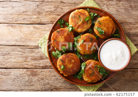 Indian potato patties Aloo Tikki served with 62175157