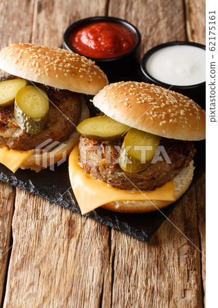 Delicious burgers made with fried onions for added Delicious burgers made with fried onions for added 62175161