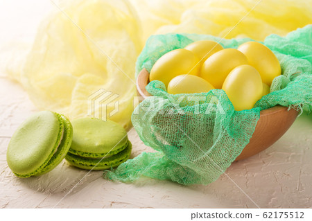 Easter eggs in a wooden bowl 62175512