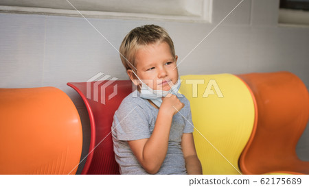 Boy wearing facial disposable mask. Virus Boy wearing facial disposable mask. Virus 62175689