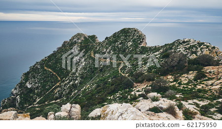 Huge cliff covered with vegetation 62175950