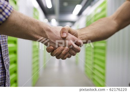 Handshake of people 62176220