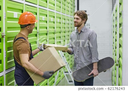 Man getting the parcel 62176243