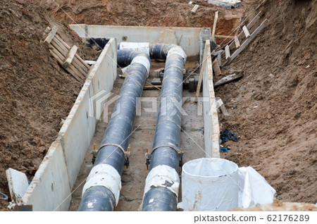 Large black metal and plastic water pipes for hot  62176289