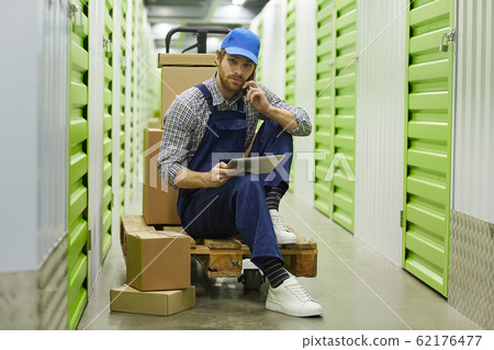 Worker discussing work on the phone 62176477