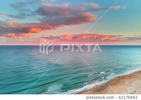 Mediterranean Sea and beach during sunset 62176662