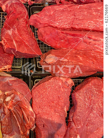 Closeup photo of fresh red beef meat at supermarket 62176669