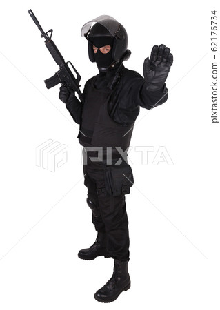 Riot police officer in black uniform with assault Riot police officer in black uniform with assault 62176734