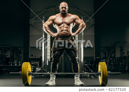Bodybuilder athletic man back muscles deadlift 62177320